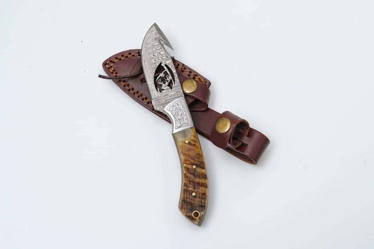 Collection of durable outdoor gear including knives and survival tools for backcountry adventures